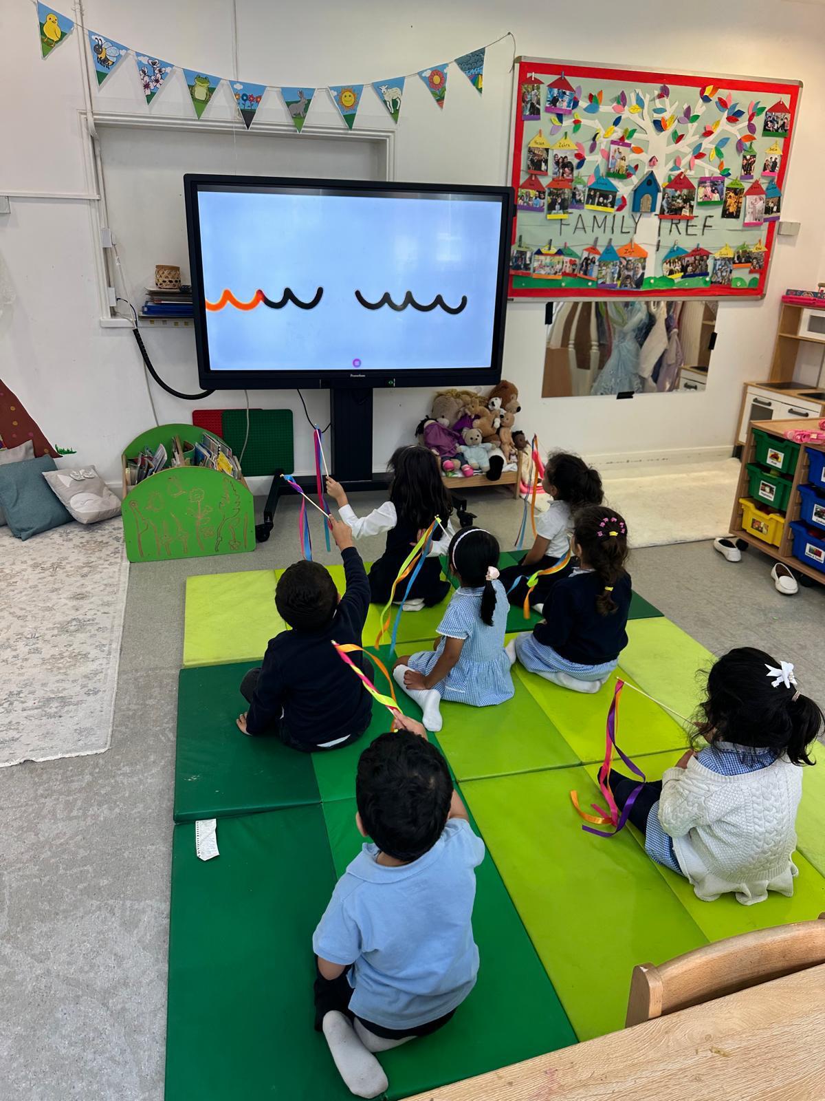 Children taking part in a group activity in a nursery classroom